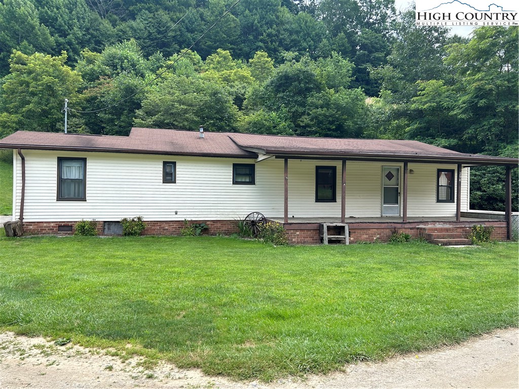 294 Walter Blevins Road Lansing, NC 28643 - Photo 1 of 15 a view of a house with a backyard