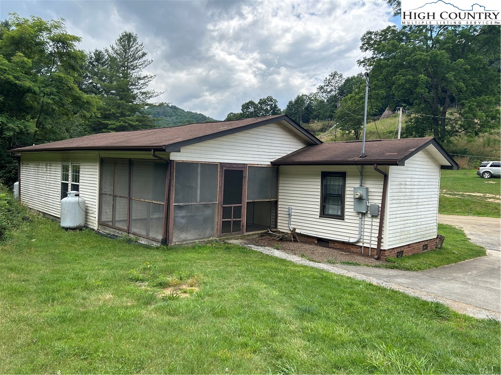 294 Walter Blevins Road Lansing, NC 28643 - Photo 12 of 15 a view of a house with a yard