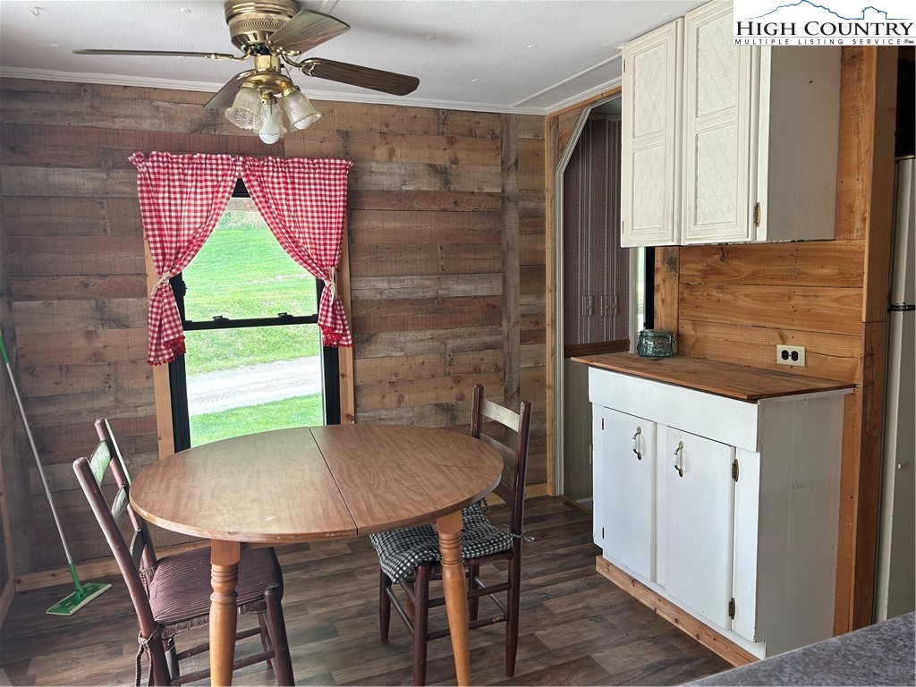 294 Walter Blevins Road Lansing, NC 28643 - Photo 4 of 15 a kitchen that has a cabinets counter space and a window