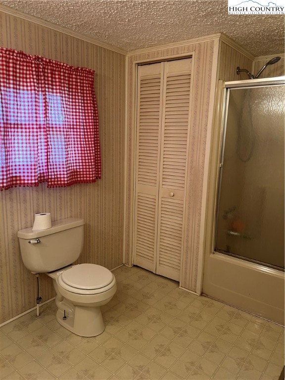 294 Walter Blevins Road Lansing, NC 28643 - Photo 10 of 15 a bathroom with a toilet and a shower