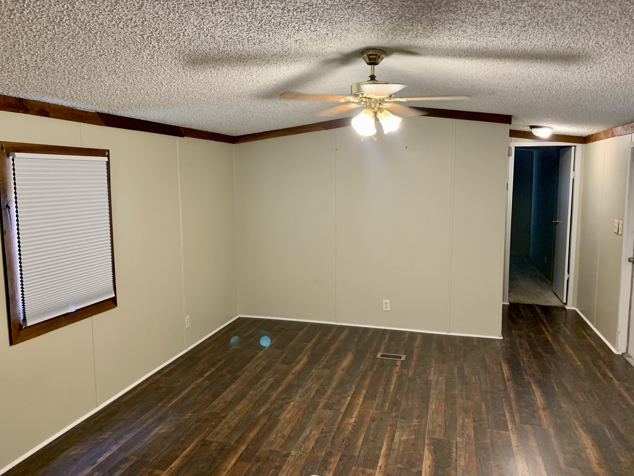 30 Jacks Road Elora, TN 37328 - Photo 2 of 14 a view of room with a ceiling fan and wooden floor