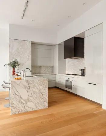 a view of a dining room with furniture and window