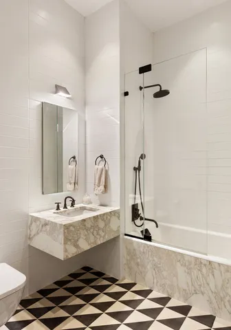 a large bedroom with a large bed and a large window