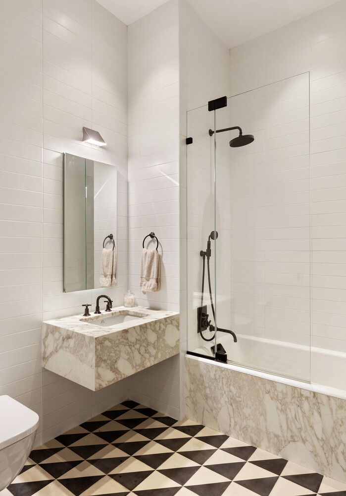 45 Great Jones Street, Unit 2 Manhattan, NY 10012 - Photo 8 of 11 a bathroom with a sink and a mirror