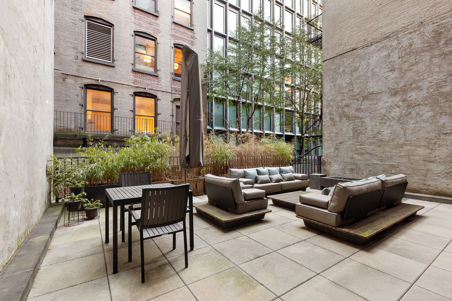 45 Great Jones Street, Unit 2 Manhattan, NY 10012 - Photo 9 of 11 a patio with patio couch and outdoor seating