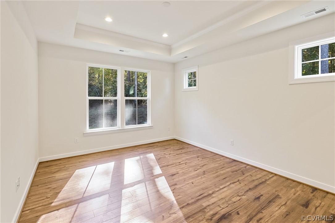 1706 Mainsail Lane Chester, VA 23836 - Photo 14 of 28 a view of an empty room with wooden floor and a window
