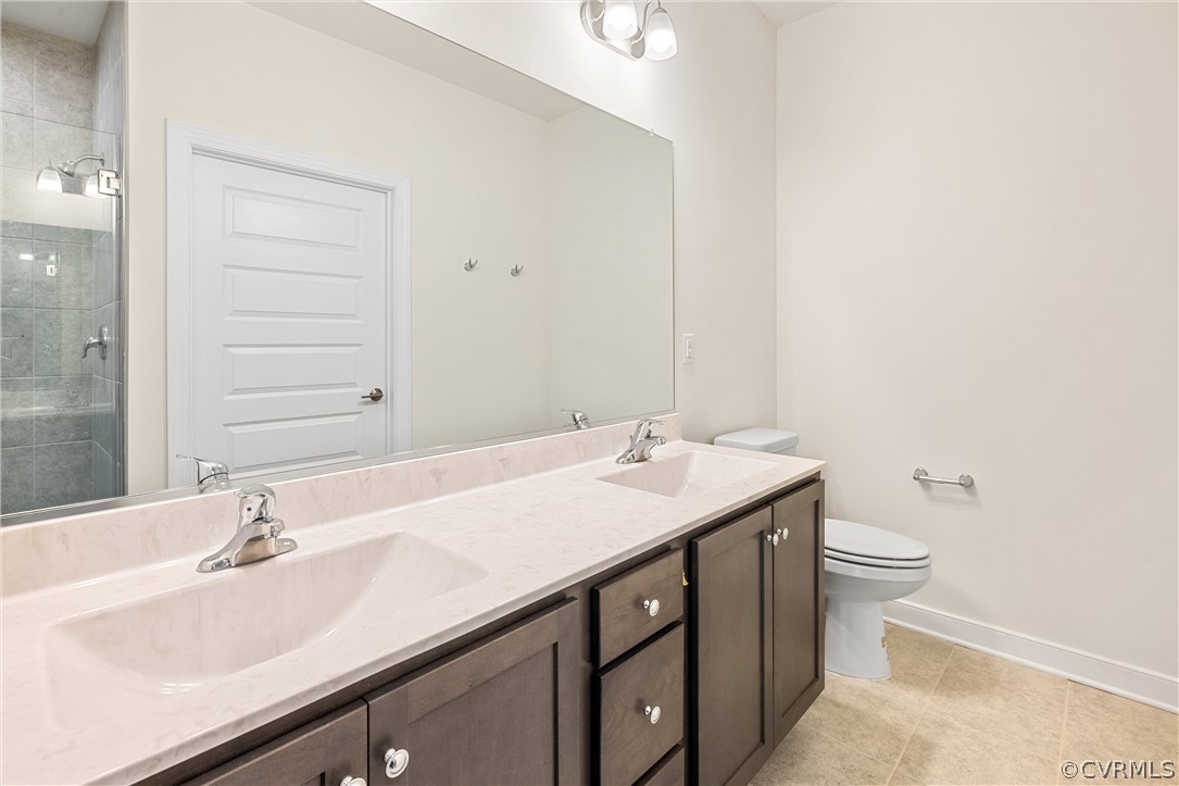 1706 Mainsail Lane Chester, VA 23836 - Photo 16 of 28 a bathroom with a sink and a toilet