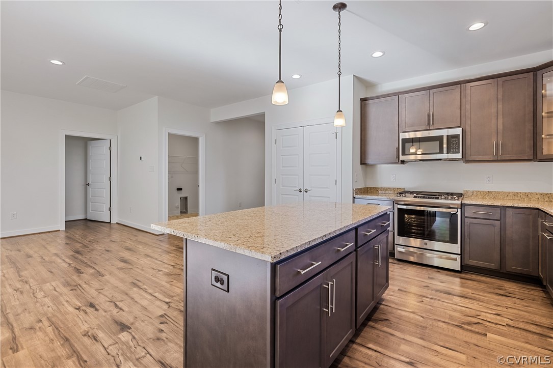 1706 Mainsail Lane Chester, VA 23836 - Photo 3 of 28 a kitchen with a stove and a wooden floor