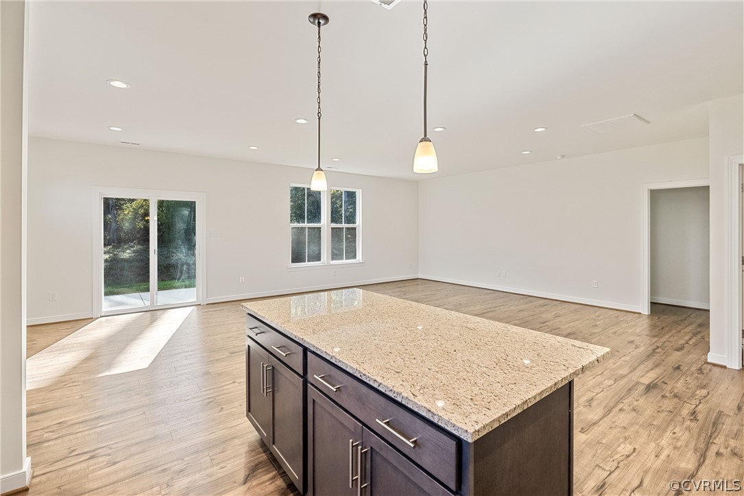 1706 Mainsail Lane Chester, VA 23836 - Photo 9 of 28 a kitchen with a sink stove and wooden floor