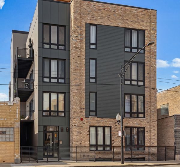 2135 West Cermak Road, Unit 3S Chicago, IL 60608 - Photo 1 of 14 front view of residential houses