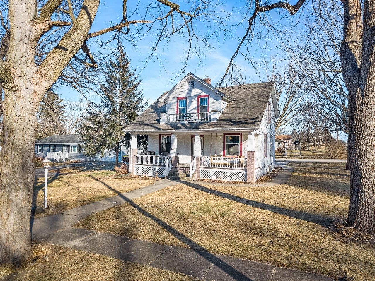 239 South Walnut Street Stillman Valley, IL 61084 - Photo 1 of 42 a view of a house with a large tree and sitting area