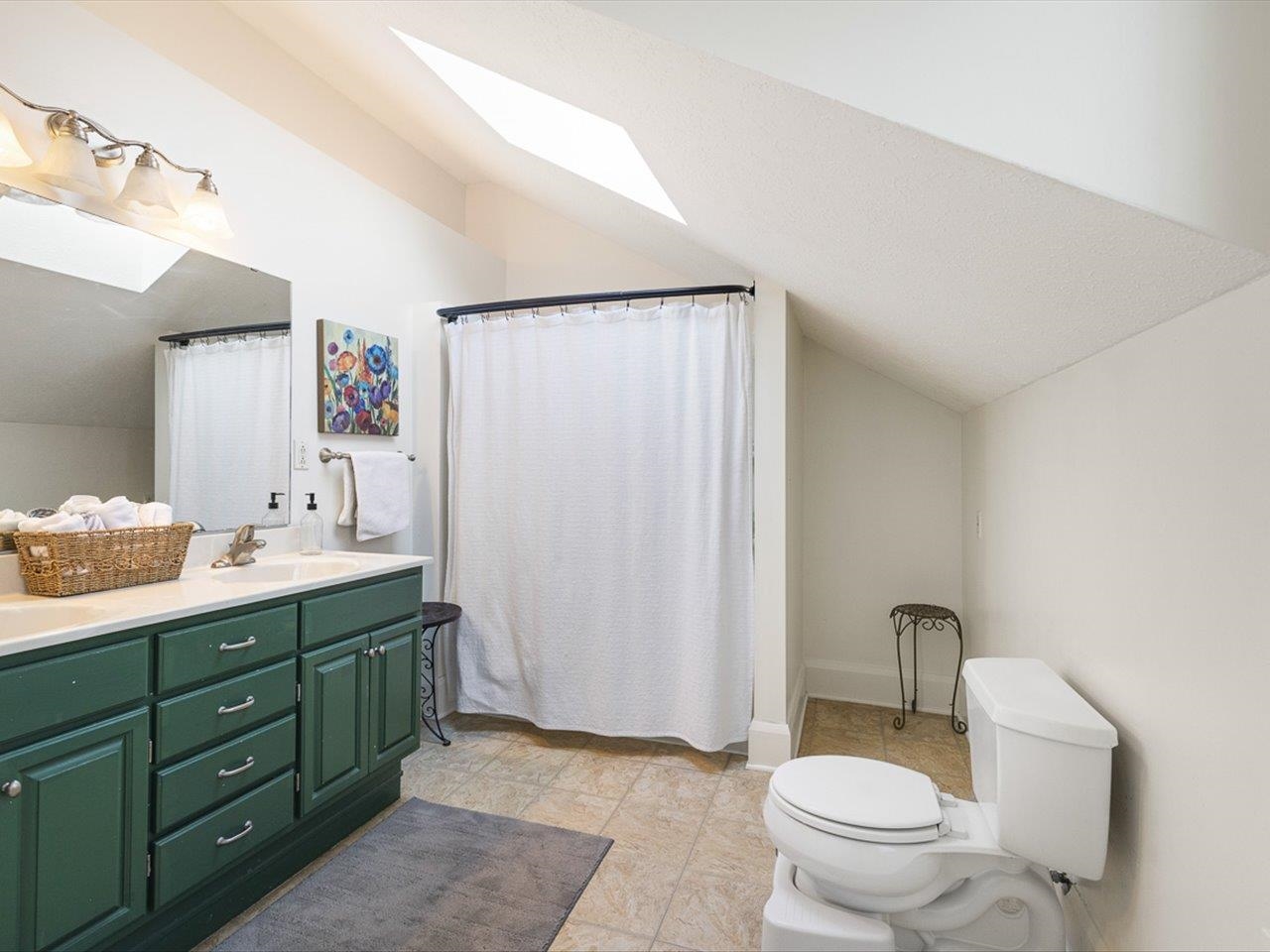 239 South Walnut Street Stillman Valley, IL 61084 - Photo 14 of 42 a bathroom with a double vanity sink mirror and toilet