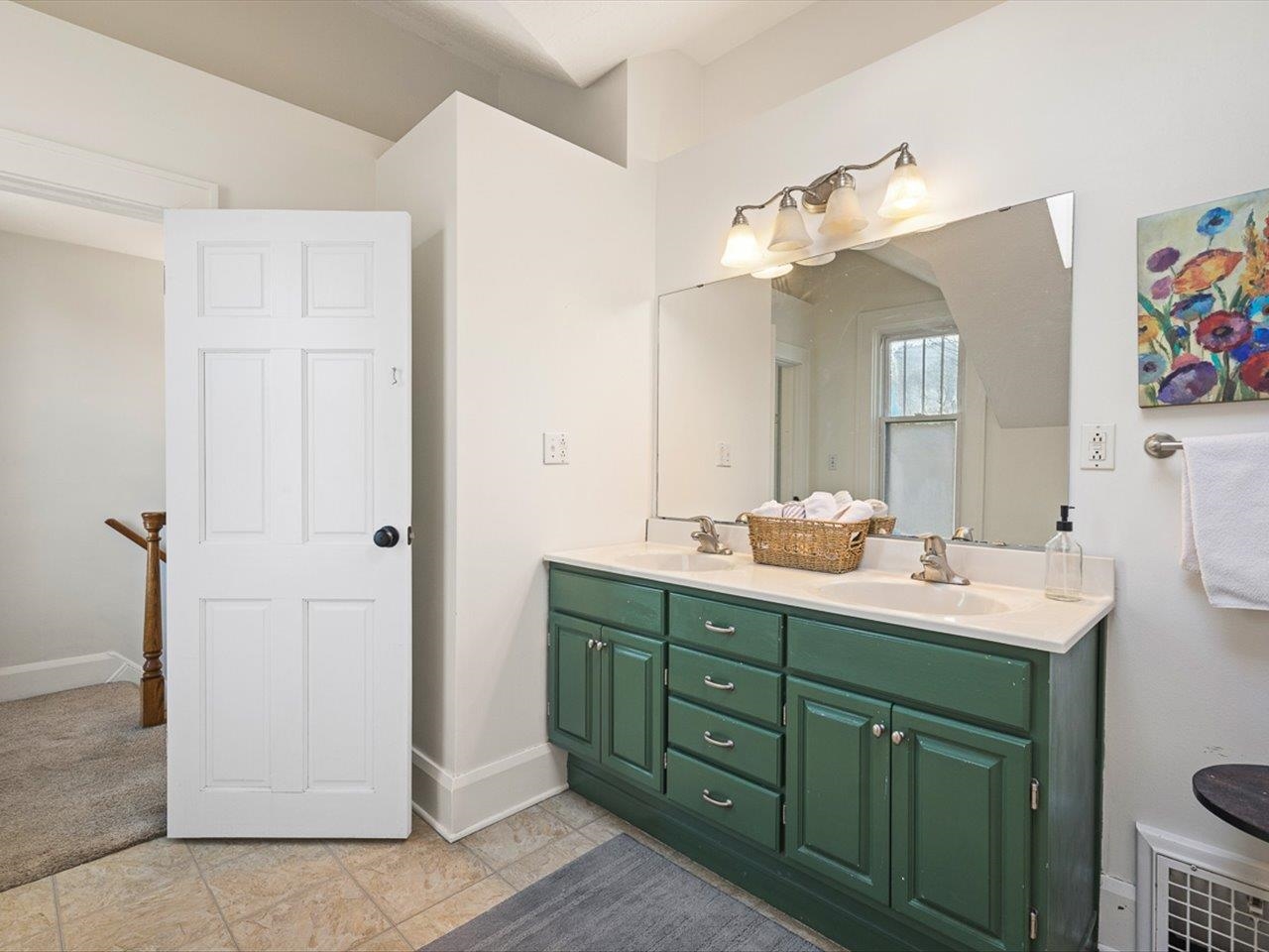 239 South Walnut Street Stillman Valley, IL 61084 - Photo 15 of 42 a bathroom with a double vanity sink and a mirror