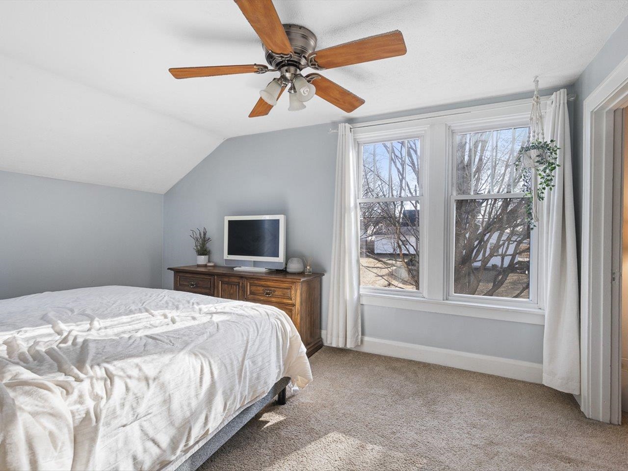 239 South Walnut Street Stillman Valley, IL 61084 - Photo 16 of 42 a bedroom with a large bed and a window