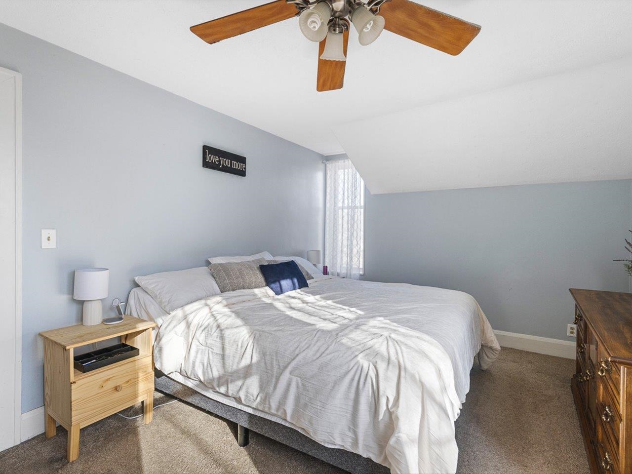 239 South Walnut Street Stillman Valley, IL 61084 - Photo 17 of 42 a bedroom with a bed and a chandelier