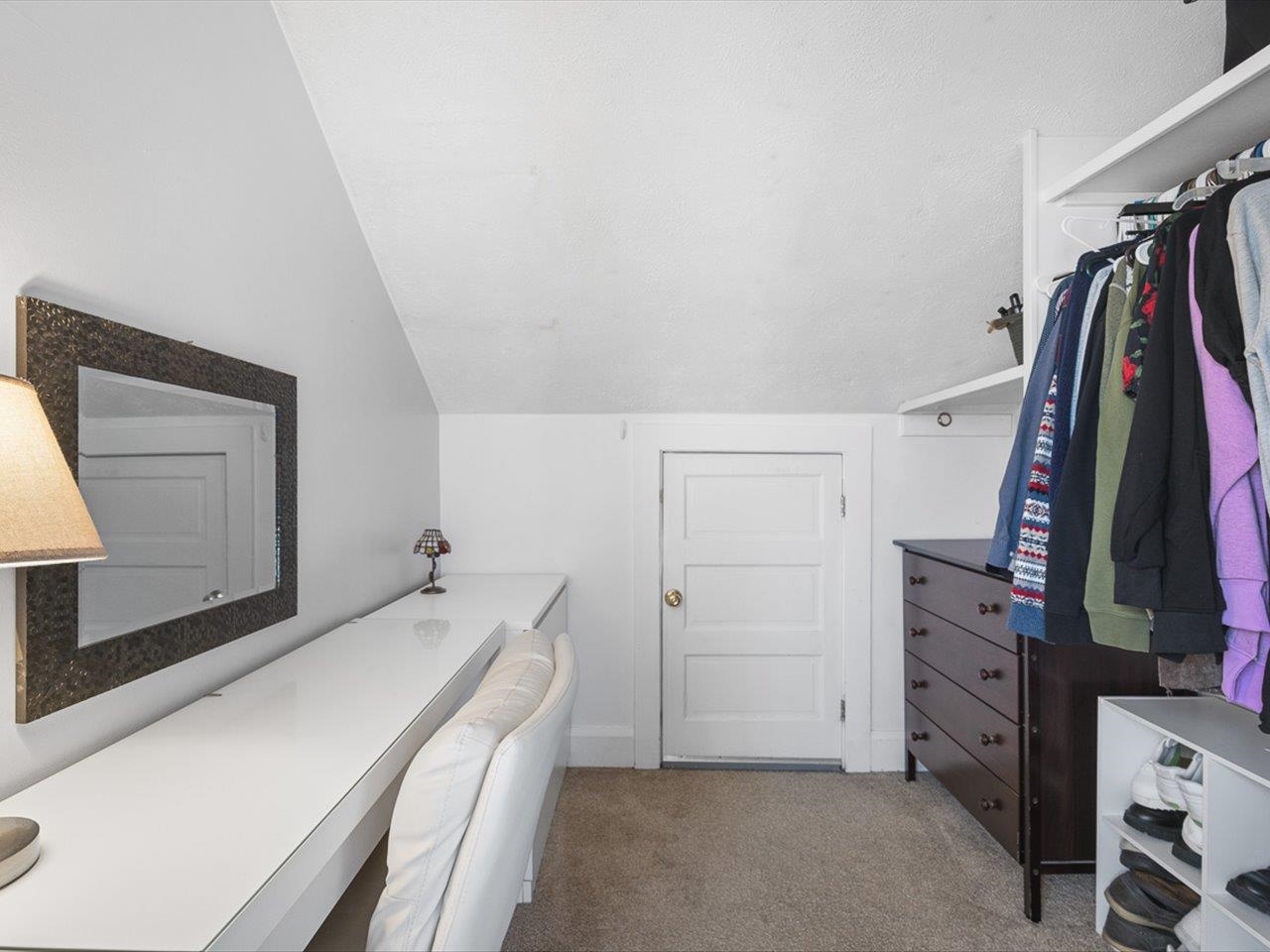239 South Walnut Street Stillman Valley, IL 61084 - Photo 18 of 42 a view of walk in closet with clothes and shoes
