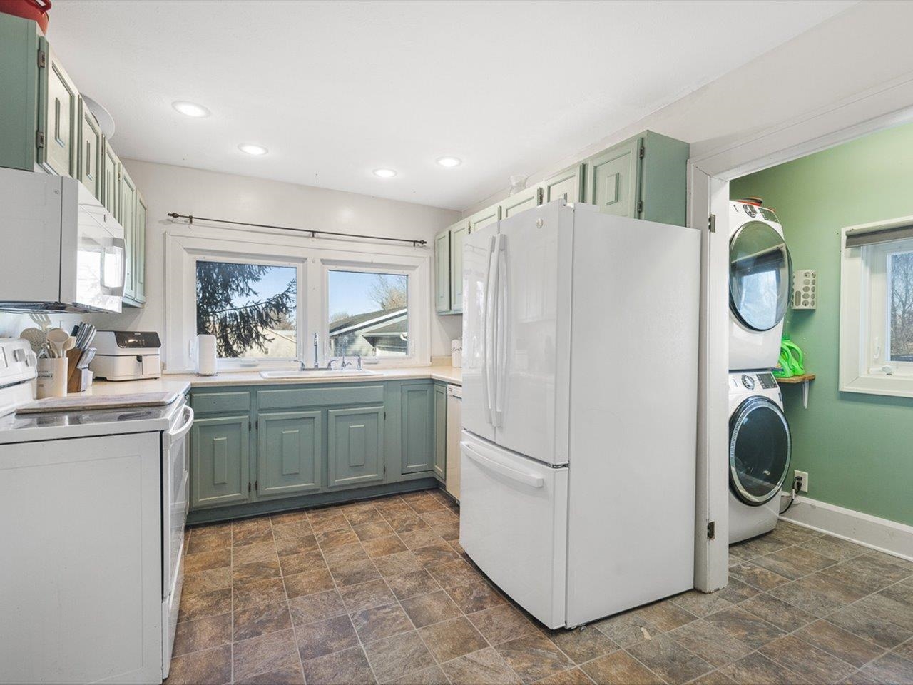 239 South Walnut Street Stillman Valley, IL 61084 - Photo 24 of 42 a kitchen with a refrigerator and a sink