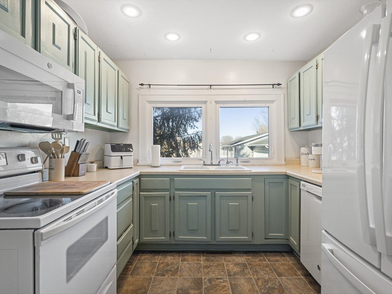 239 South Walnut Street Stillman Valley, IL 61084 - Photo 25 of 42 a kitchen with a sink stove and cabinets