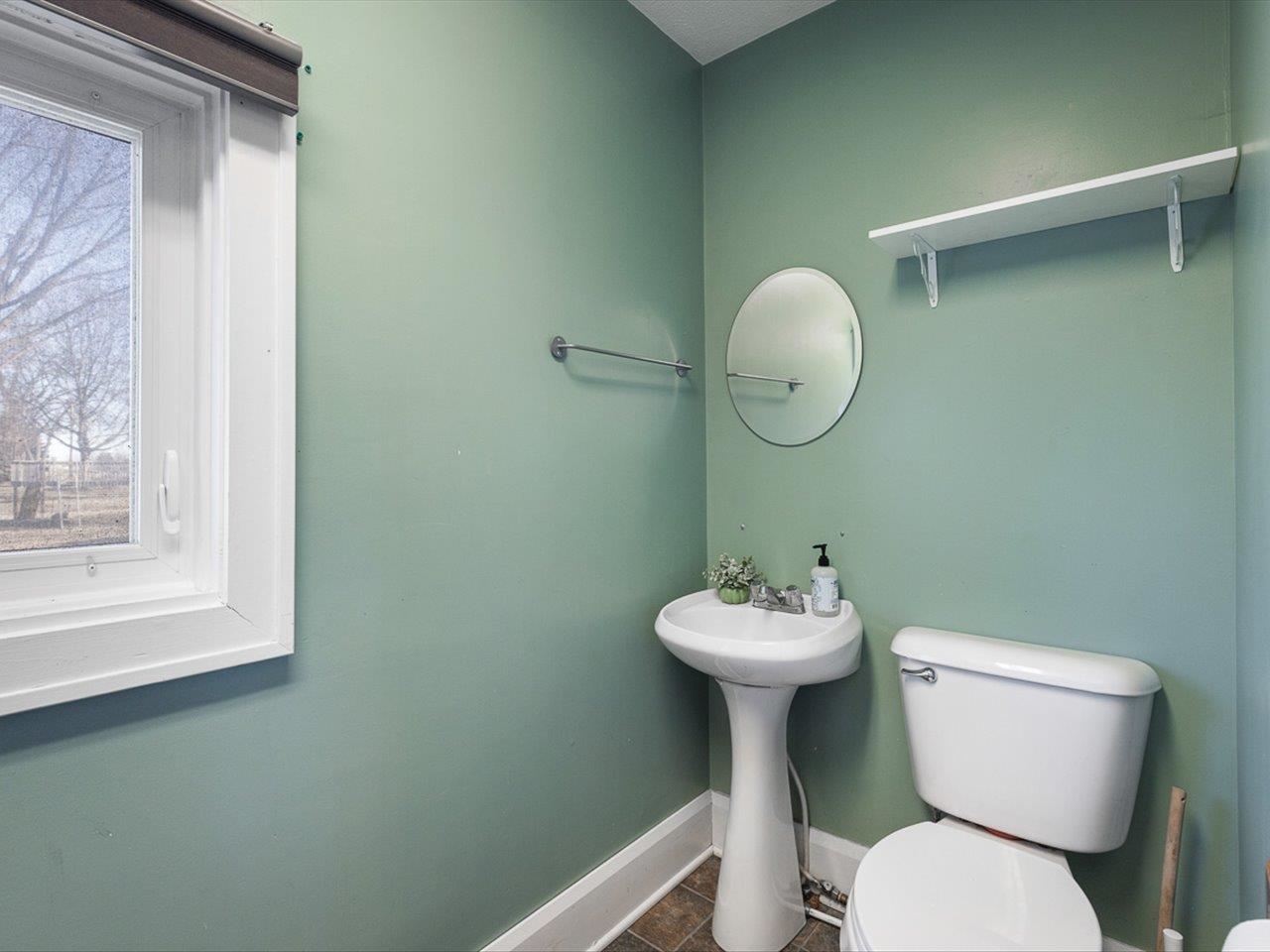 239 South Walnut Street Stillman Valley, IL 61084 - Photo 28 of 42 a bathroom with a toilet sink and mirror