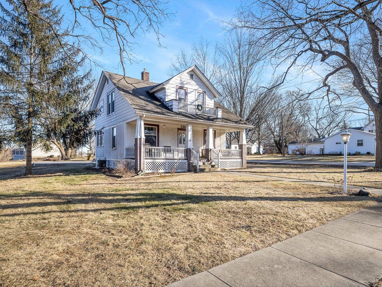239 South Walnut Street Stillman Valley, IL 61084 - Photo 4 of 42 a view of a house with a large tree in front of it