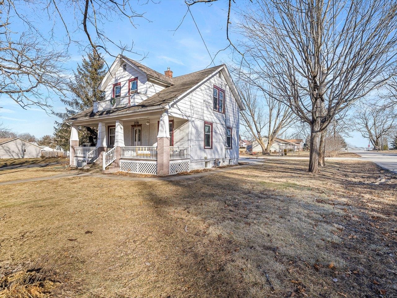 239 South Walnut Street Stillman Valley, IL 61084 - Photo 5 of 42 a view of a house with a yard covered in snow