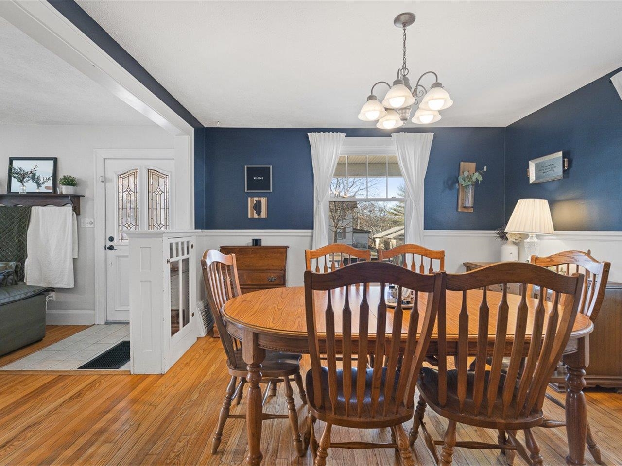 239 South Walnut Street Stillman Valley, IL 61084 - Photo 10 of 42 a view of a dining room with furniture and chandelier