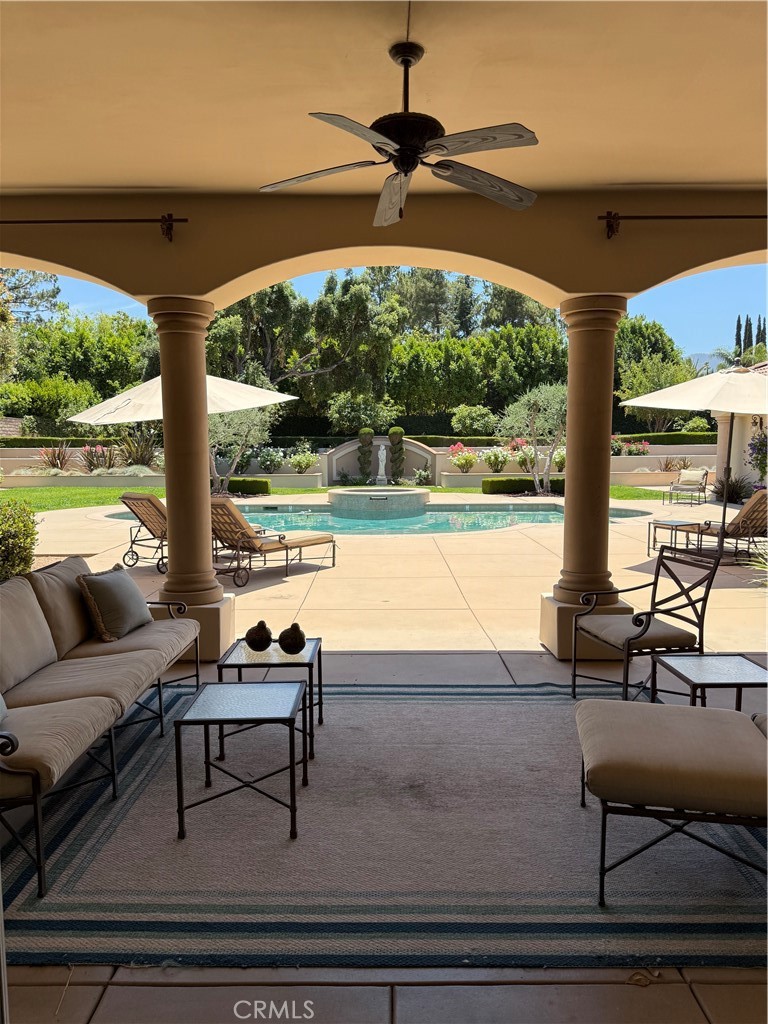 1662 Cherokee Road Corona, CA 92881 - Photo 3 of 60 a living room with furniture and floor to ceiling windows