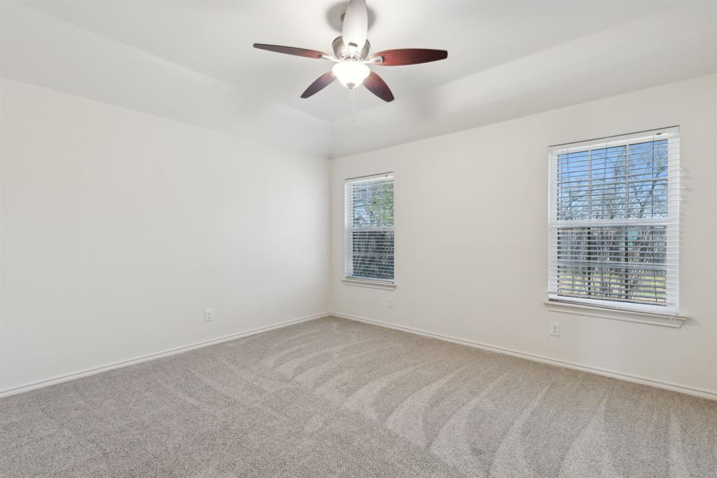 233 Firefly Drive Springtown, TX 76082 - Photo 14 of 16 Bedroom featuring ceiling fan and miniblinds.