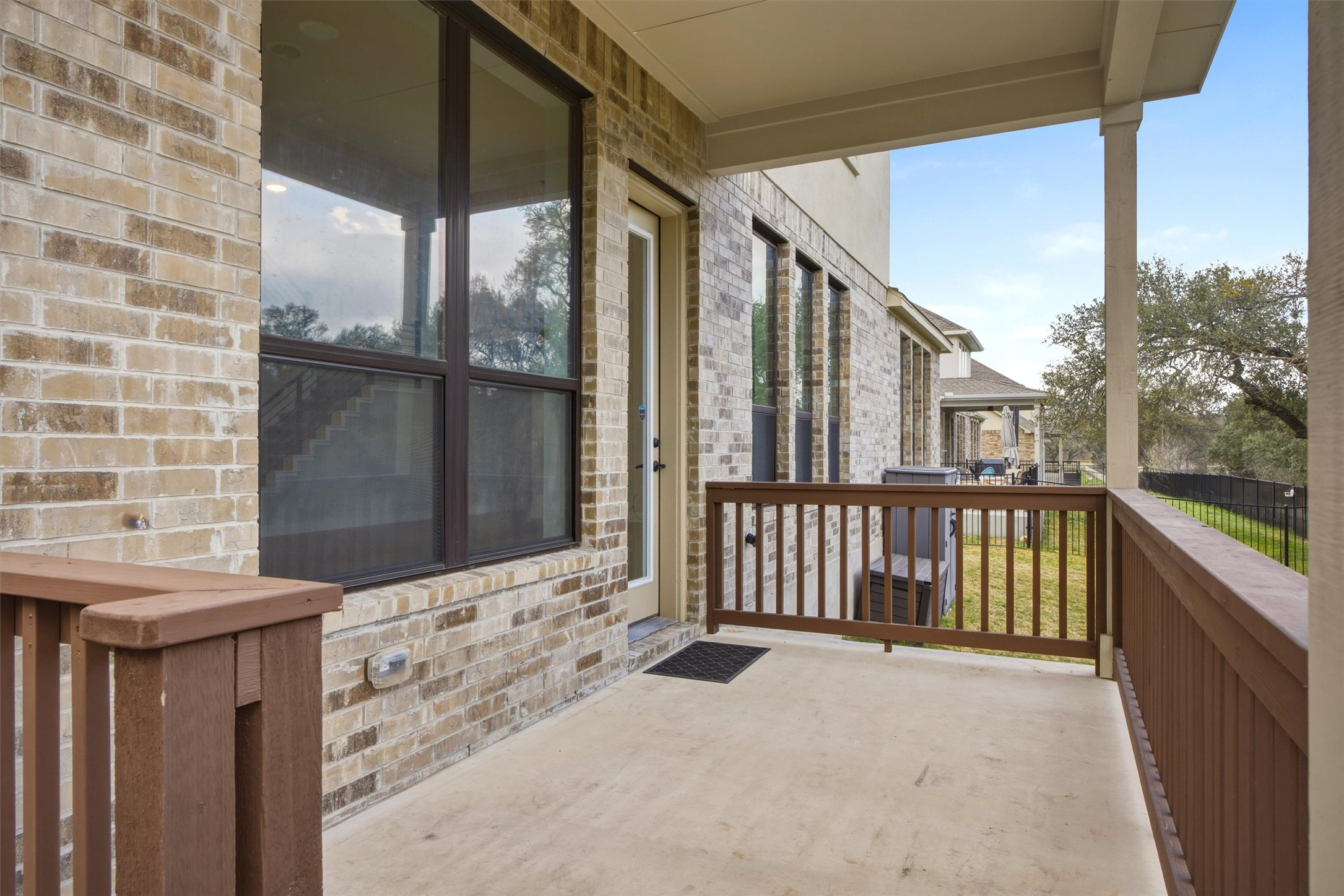 208 Tovas Secret Cove Georgetown, TX 78628 - Photo 36 of 40 a view of a balcony with wooden floor and iron fence