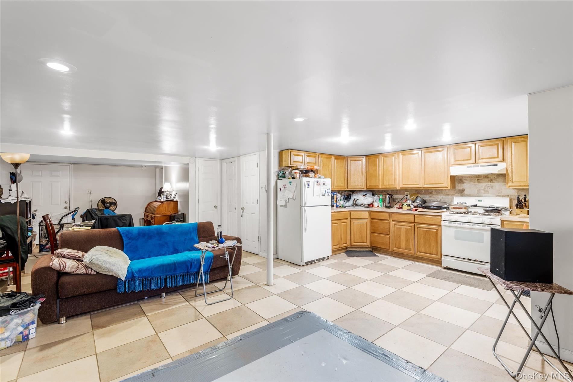 151-42 82nd Street Queens, NY 11414 - Photo 24 of 24 a living room with furniture and kitchen view