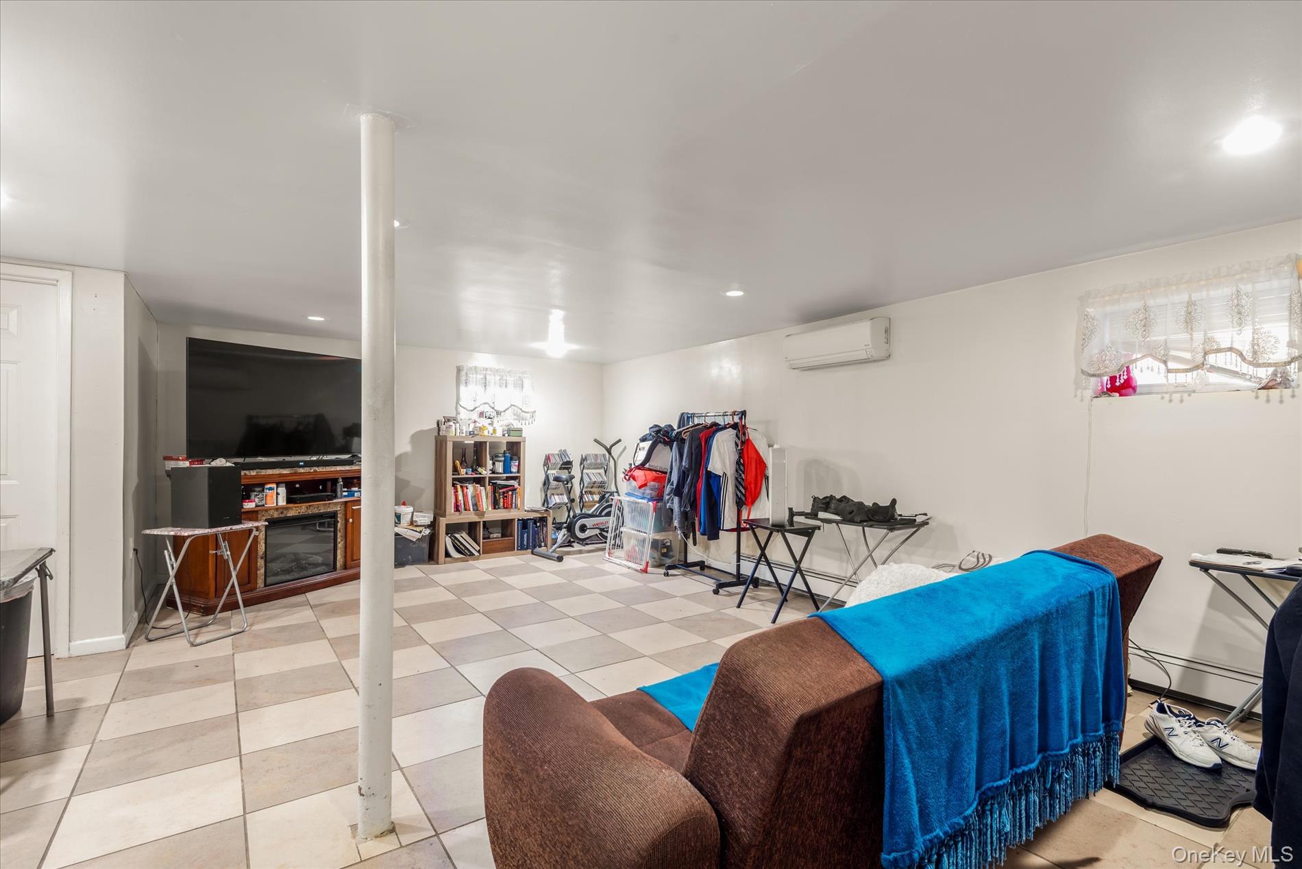 151-42 82nd Street Queens, NY 11414 - Photo 12 of 24 a view of a livingroom with furniture and a flat screen tv