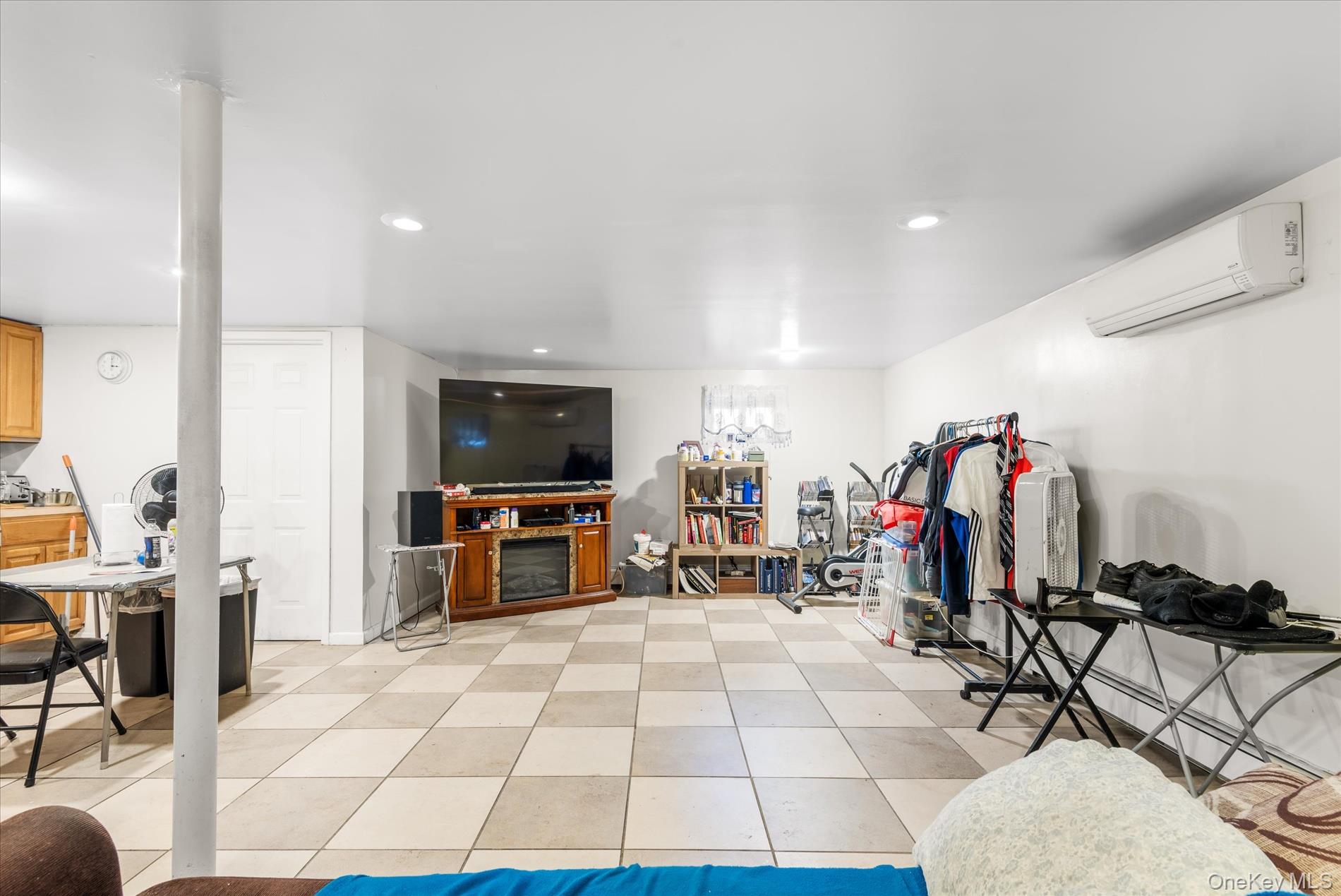 151-42 82nd Street Queens, NY 11414 - Photo 13 of 24 a living room with patio furniture and a flat screen tv