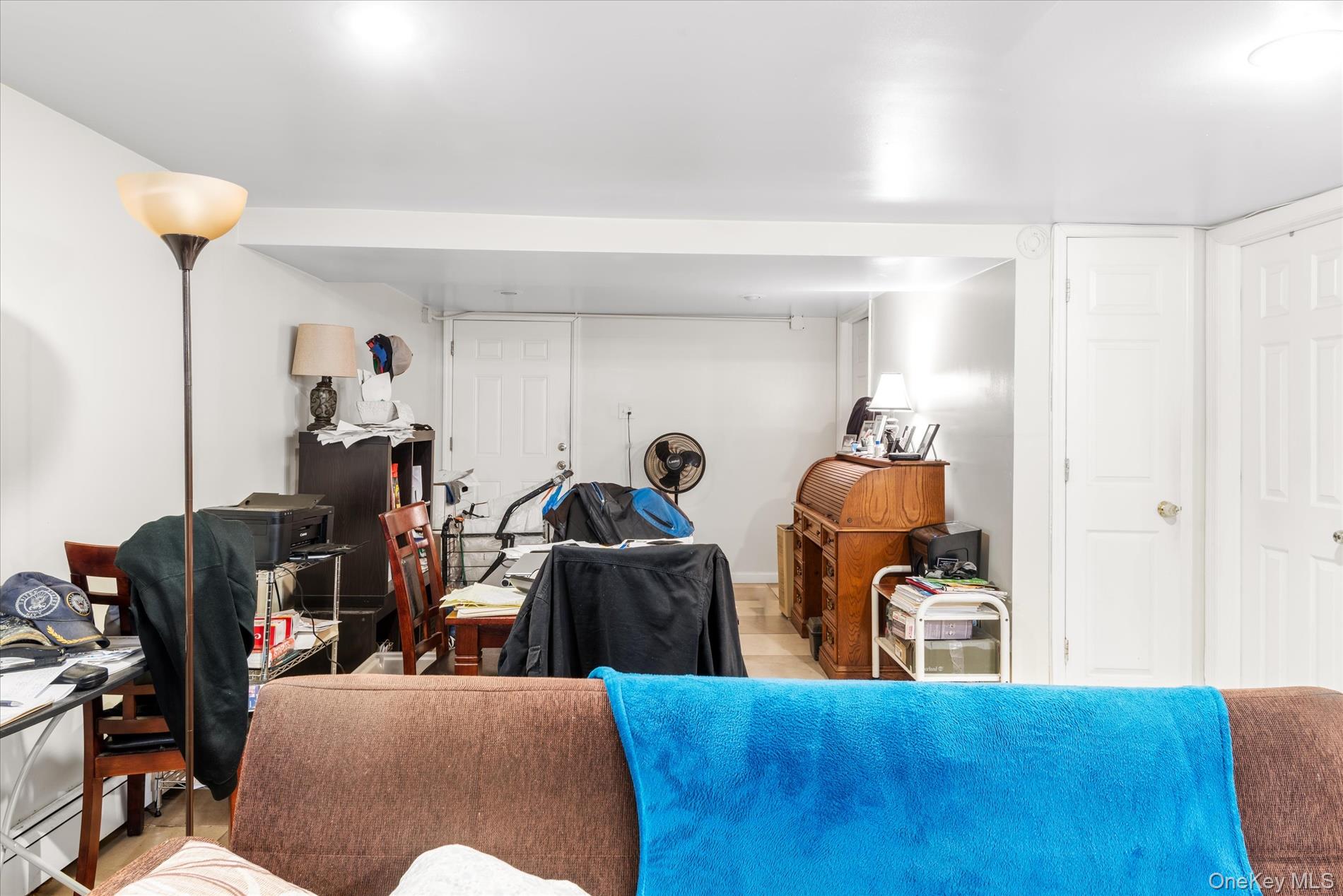 151-42 82nd Street Queens, NY 11414 - Photo 15 of 24 a living room with furniture a flat screen tv and a window