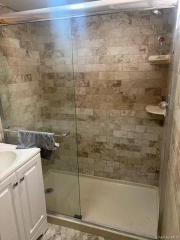 a bathroom with a shower and toilet