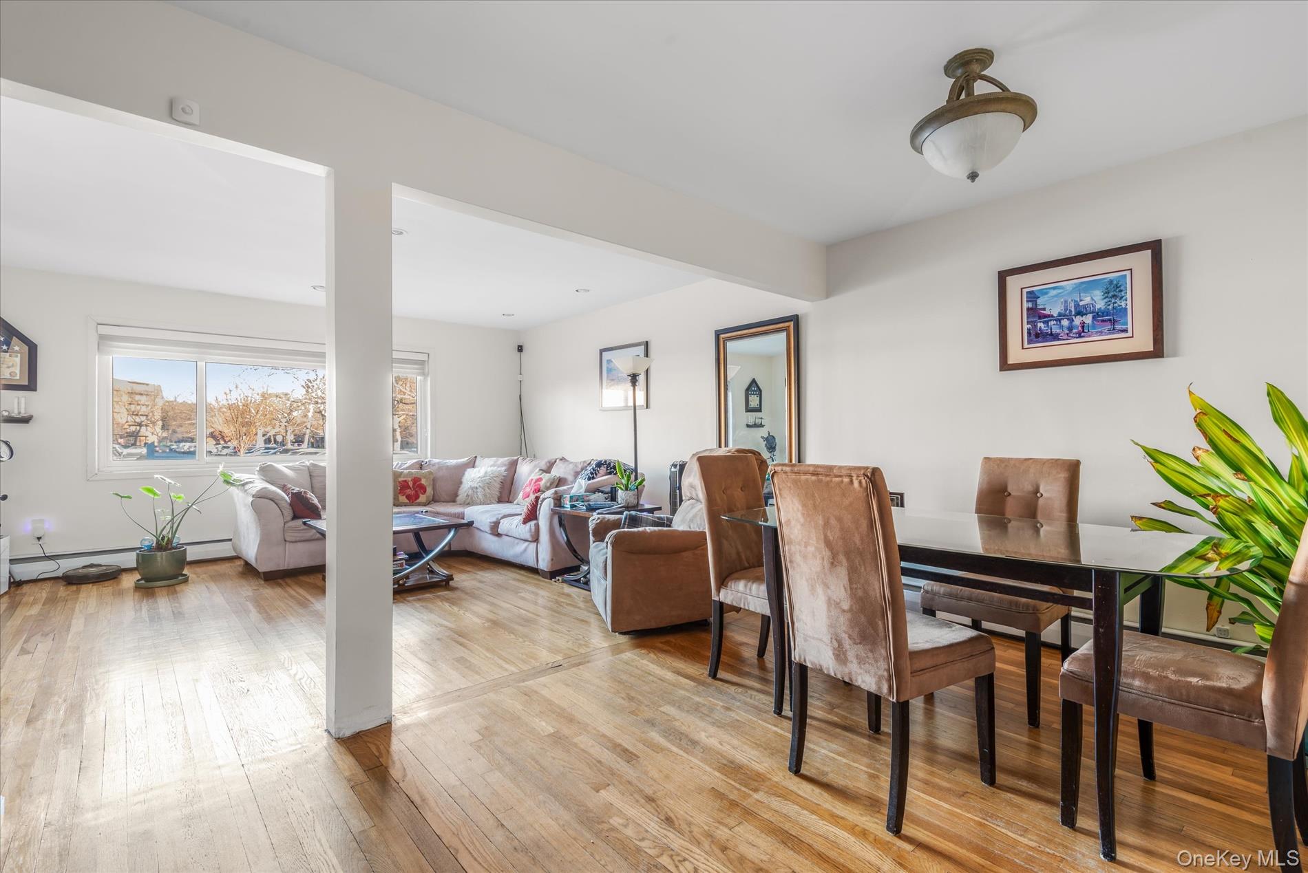 151-42 82nd Street Queens, NY 11414 - Photo 5 of 24 a living room with furniture and wooden floor