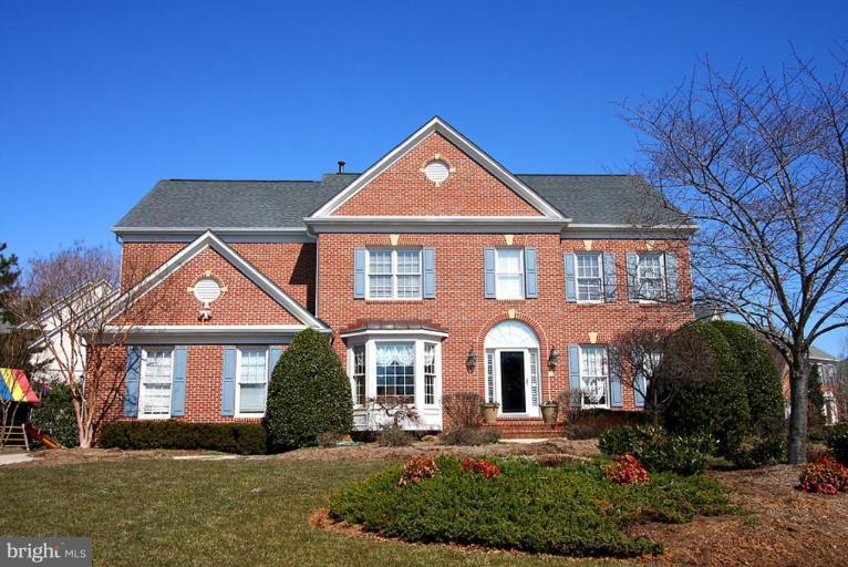 11701 Slatestone Court Potomac, MD 20854 - Photo 1 of 1 a front view of a house with a yard