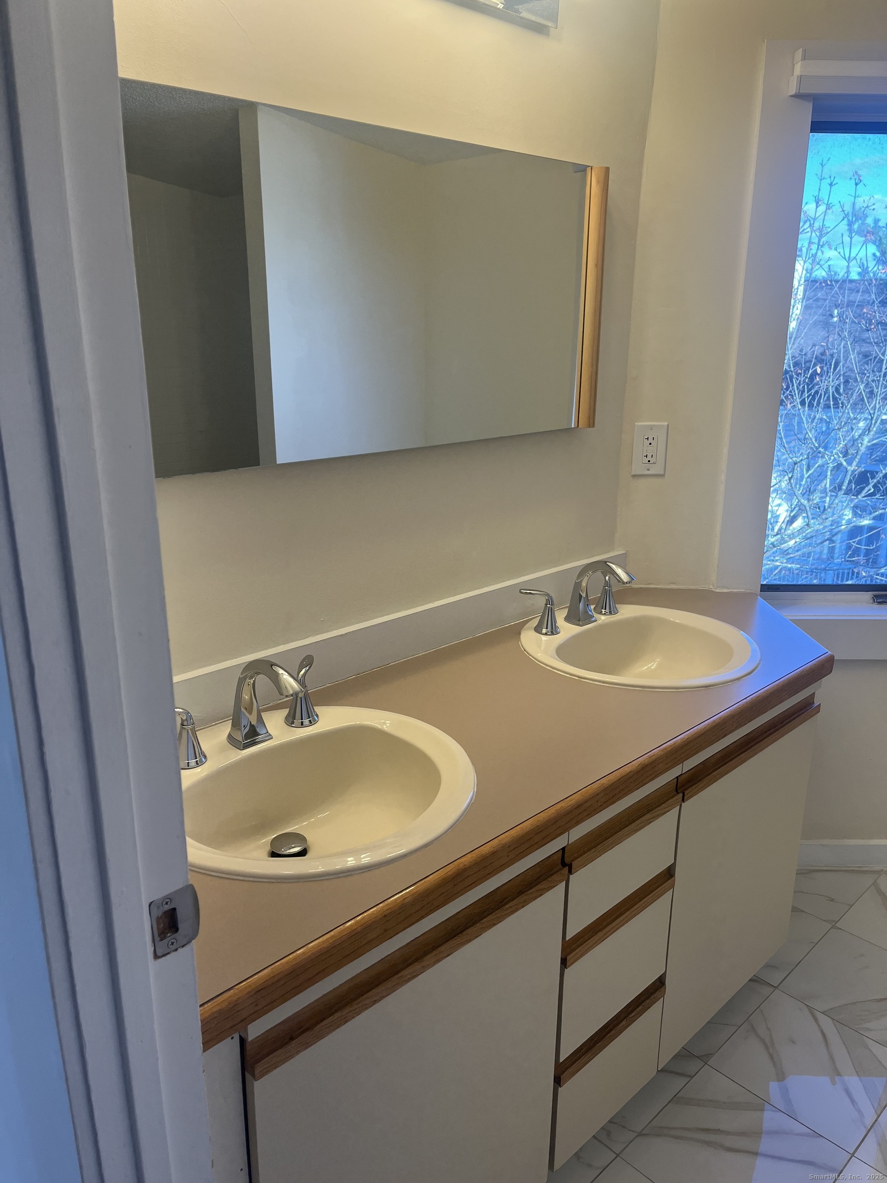 896 Quinnipiac Avenue, Unit 3 New Haven, CT 06513 - Photo 21 of 38 a bathroom with a sink and a mirror
