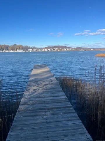 a view of deck with wooden floor and city view