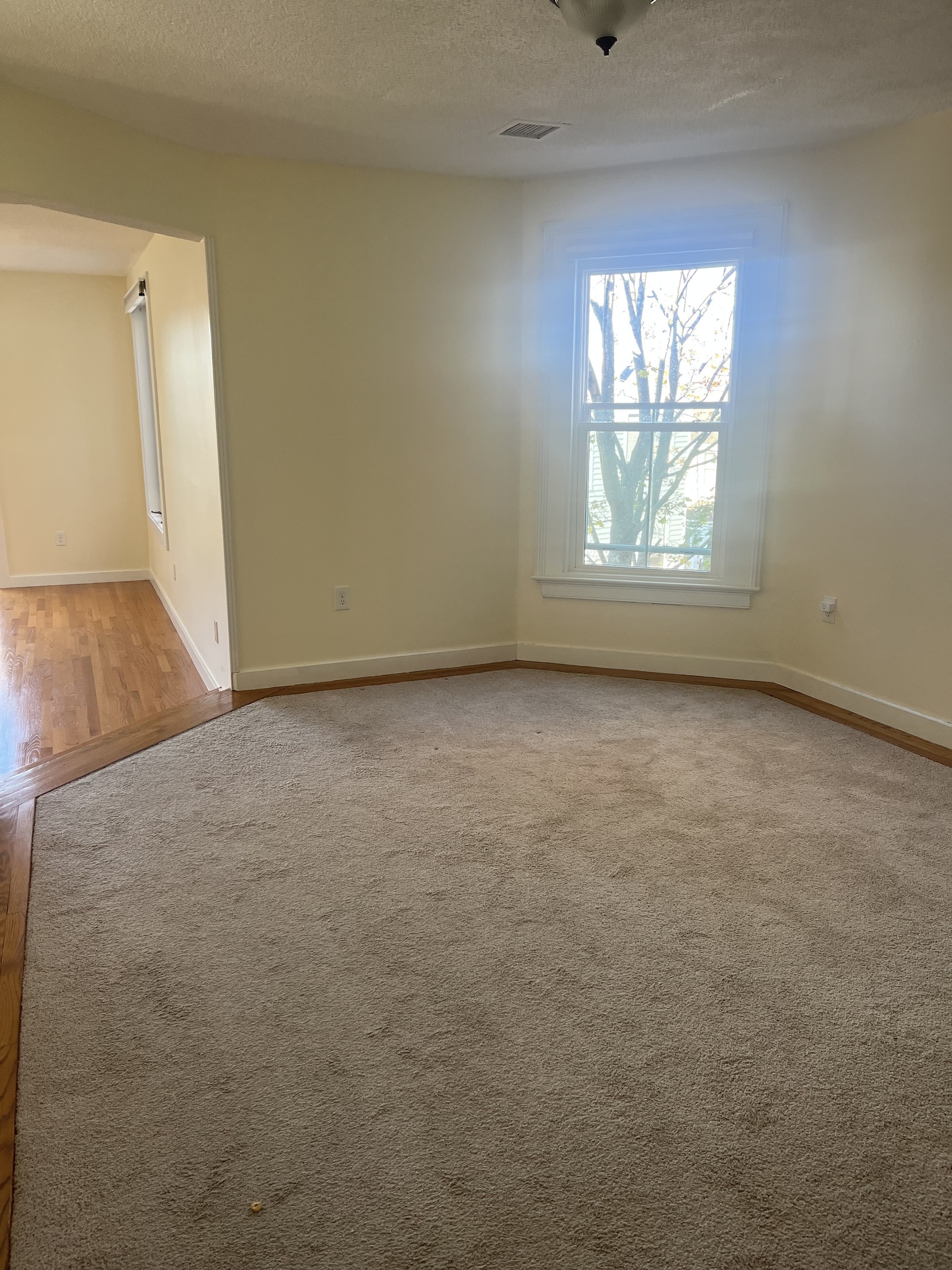 896 Quinnipiac Avenue, Unit 3 New Haven, CT 06513 - Photo 9 of 38 an empty room with windows and entrance
