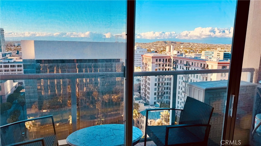 488 East Ocean Boulevard, Unit 1706 Long Beach, CA 90802 - Photo 1 of 14 a view of a city from a balcony with furniture