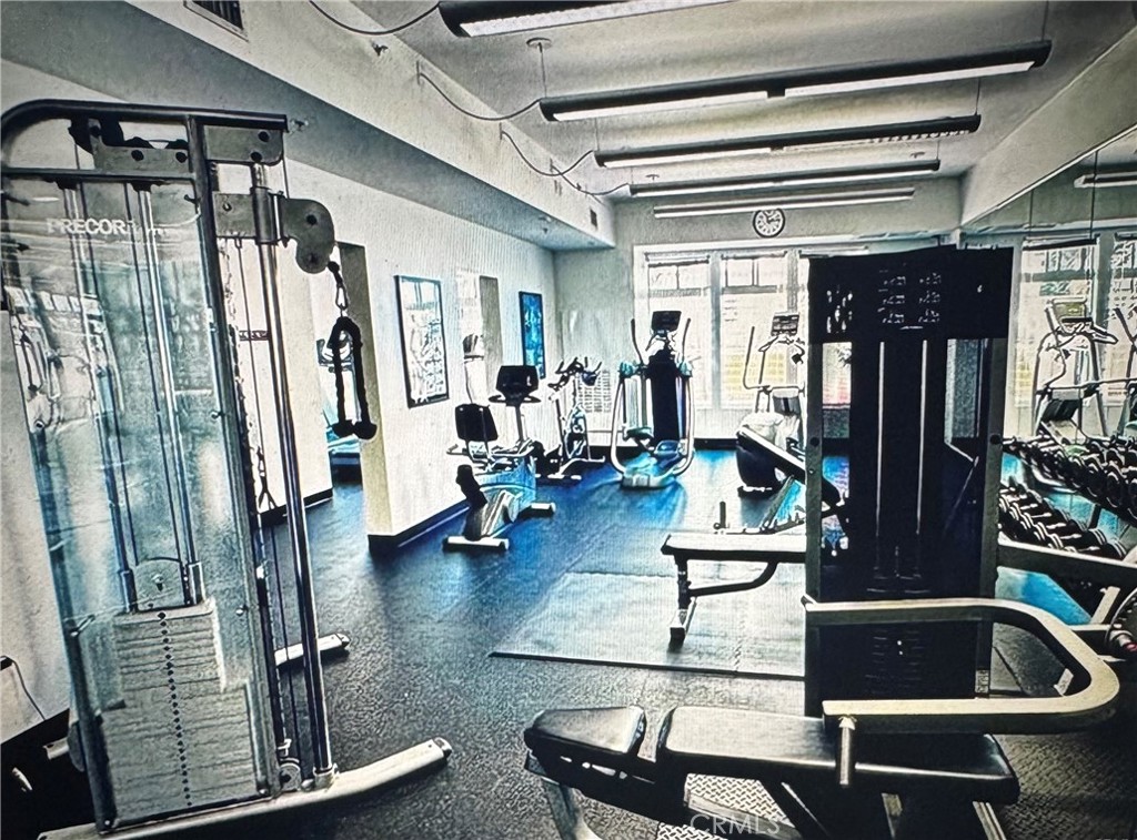 488 East Ocean Boulevard, Unit 1706 Long Beach, CA 90802 - Photo 12 of 14 a room with lots of furniture and gym equipment
