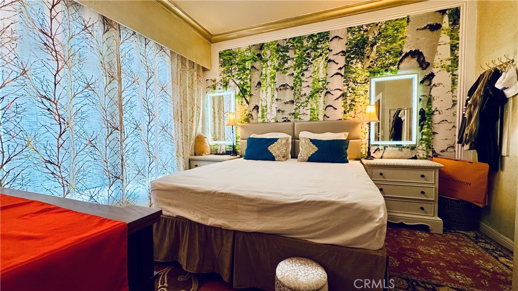 488 East Ocean Boulevard, Unit 1706 Long Beach, CA 90802 - Photo 3 of 14 a bedroom with a bed and wooden floor
