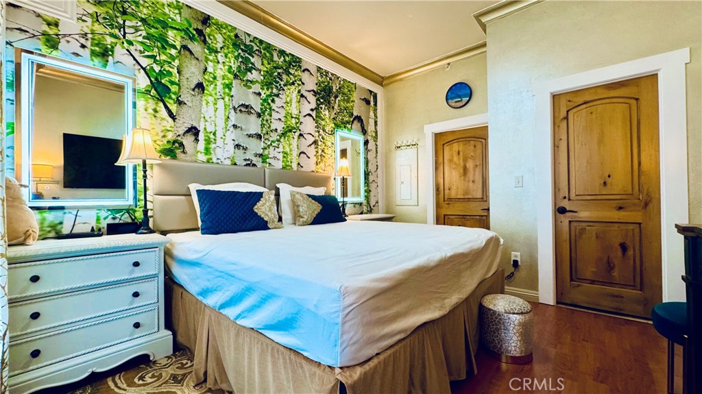 488 East Ocean Boulevard, Unit 1706 Long Beach, CA 90802 - Photo 4 of 14 a bed room with a bed and a television