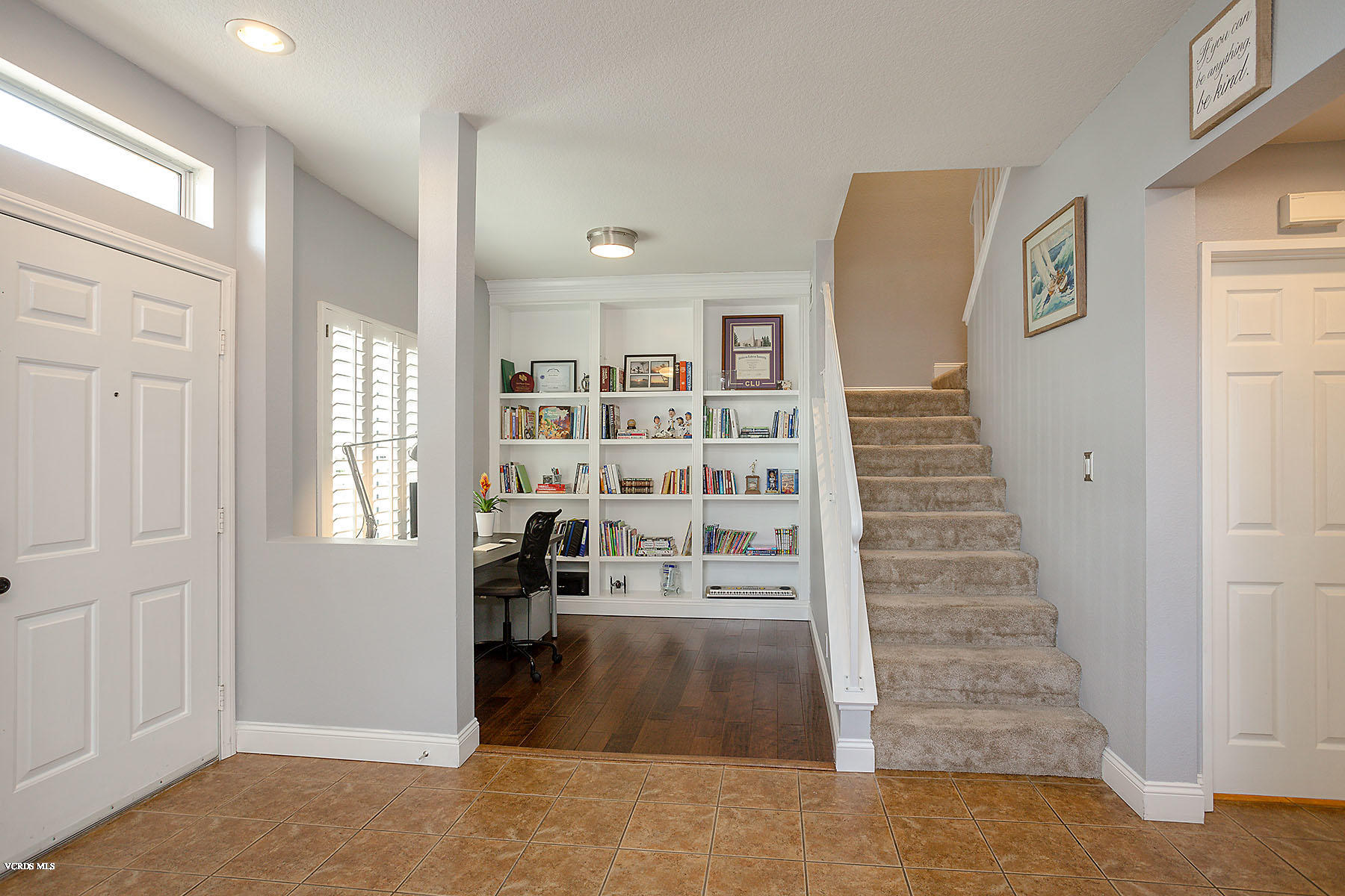 4251 Rusticview Court Moorpark, CA 93021 - Photo 11 of 27 a view of a livingroom with wooden floor and windows