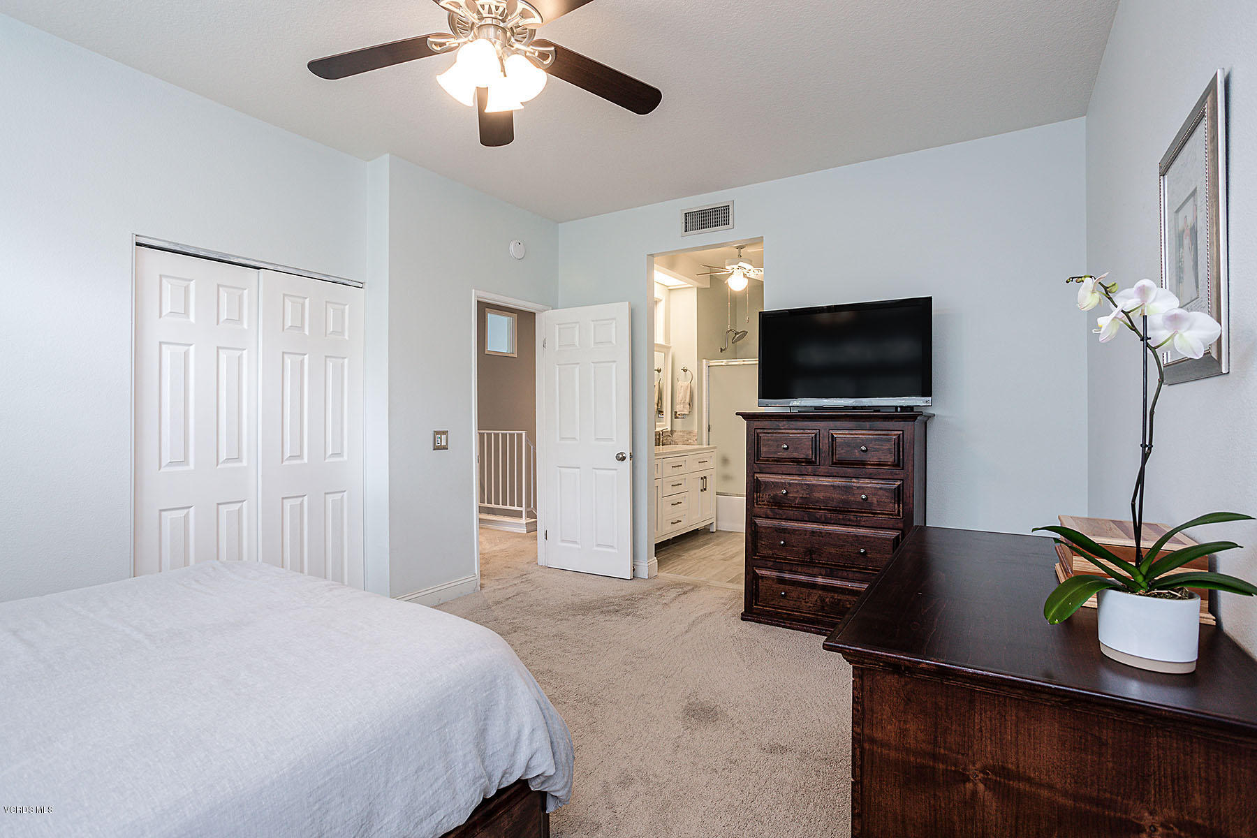 4251 Rusticview Court Moorpark, CA 93021 - Photo 13 of 27 a bedroom with a bed and a flat screen tv