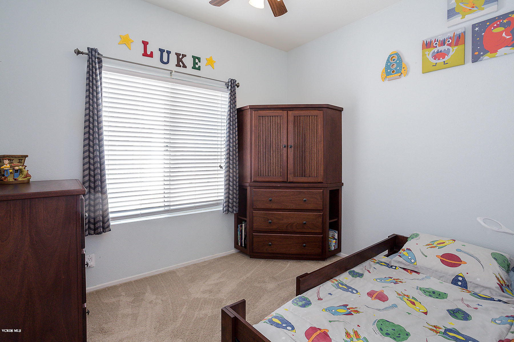 4251 Rusticview Court Moorpark, CA 93021 - Photo 17 of 27 a bedroom with a bed and a window