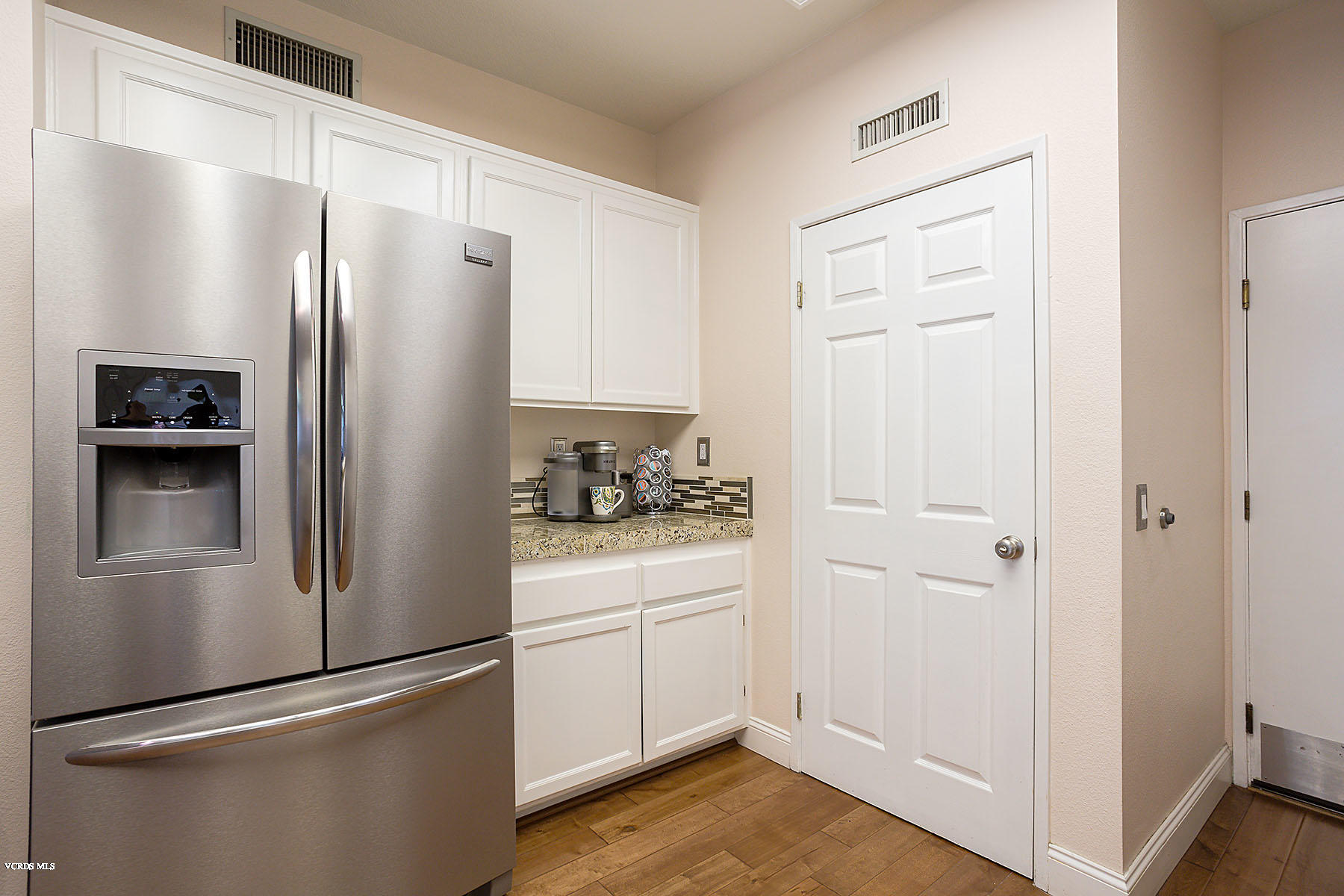 4251 Rusticview Court Moorpark, CA 93021 - Photo 7 of 27 a kitchen with a refrigerator a sink and dishwasher