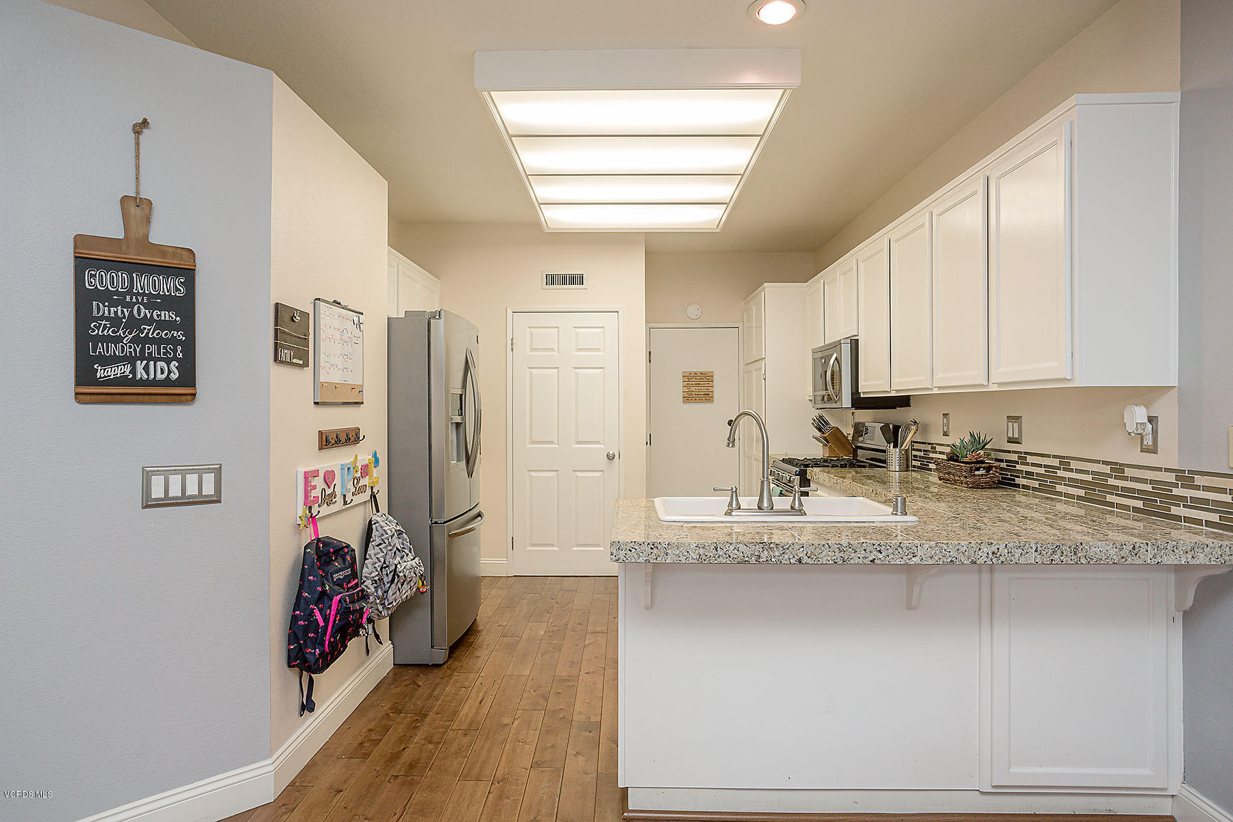 4251 Rusticview Court Moorpark, CA 93021 - Photo 8 of 27 a view of a kitchen with refrigerator and window