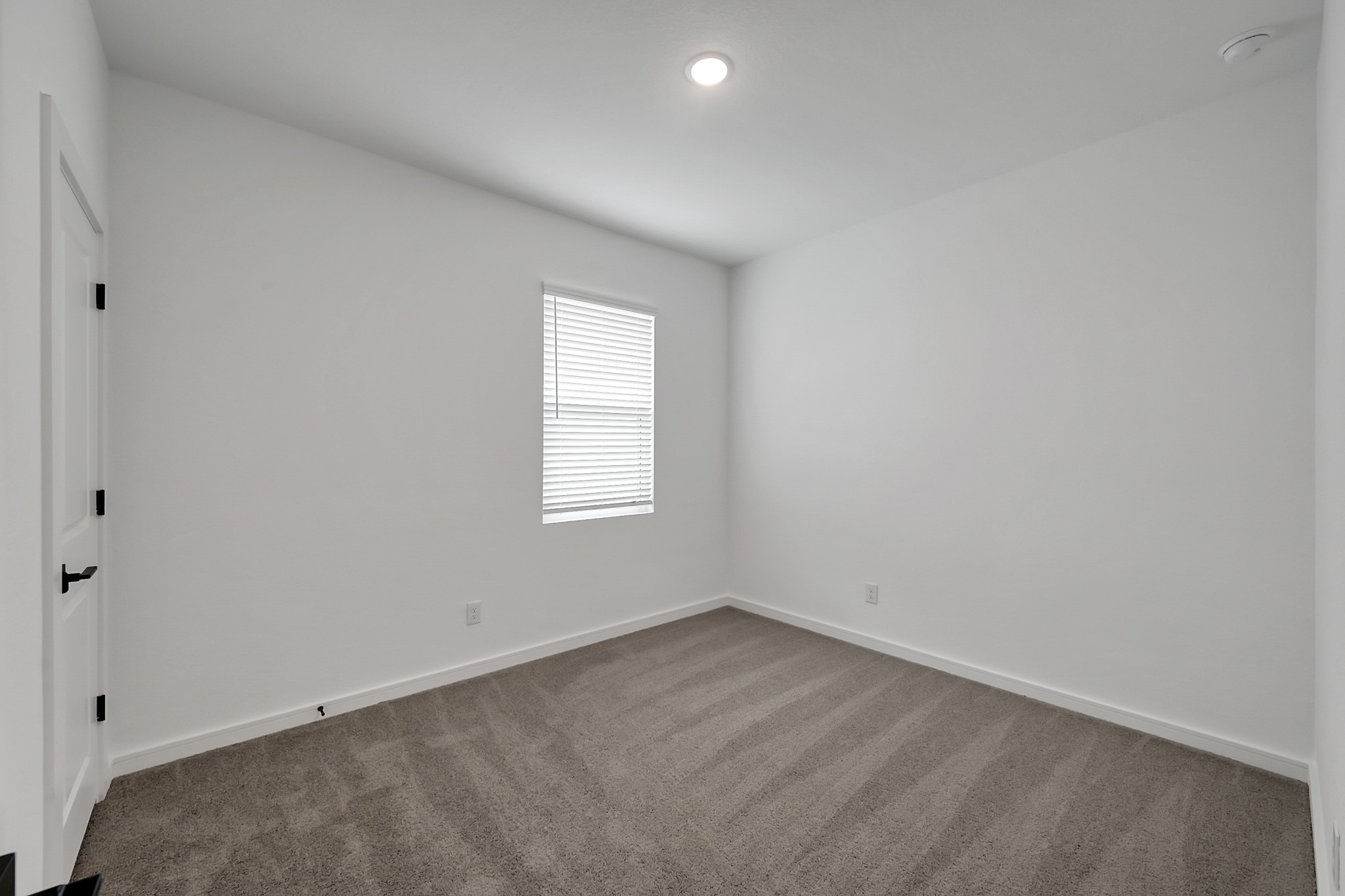 516 Monarch Trail Huntsville, TX 77340 - Photo 17 of 20 an empty room with a window