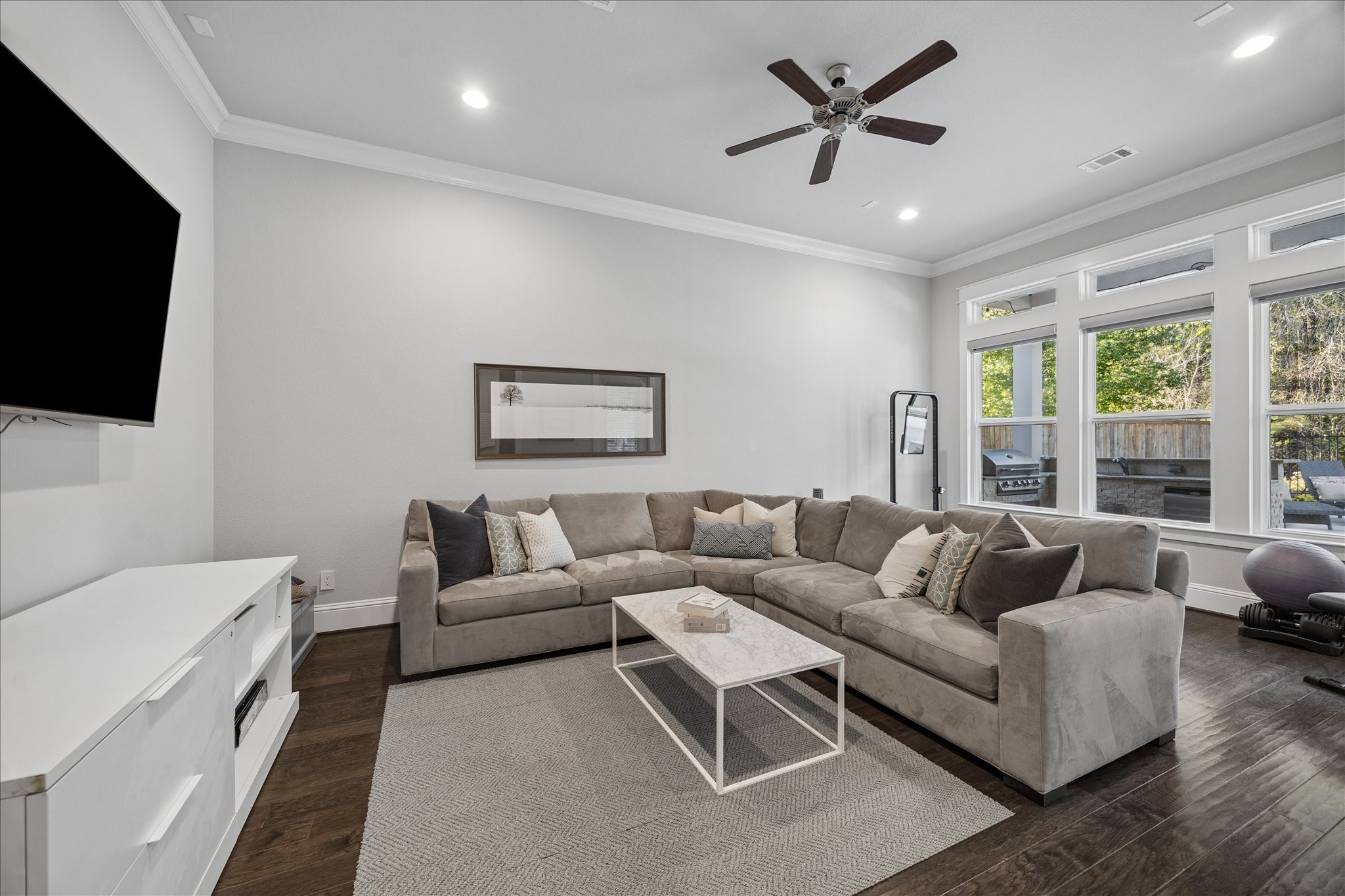 2223 Blue Duck Lane Conroe, TX 77384 - Photo 17 of 38 a living room with furniture and a flat screen tv
